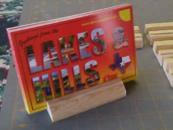 Counter Top Rack for displaying postcards on counter.  Holds 25 cards.